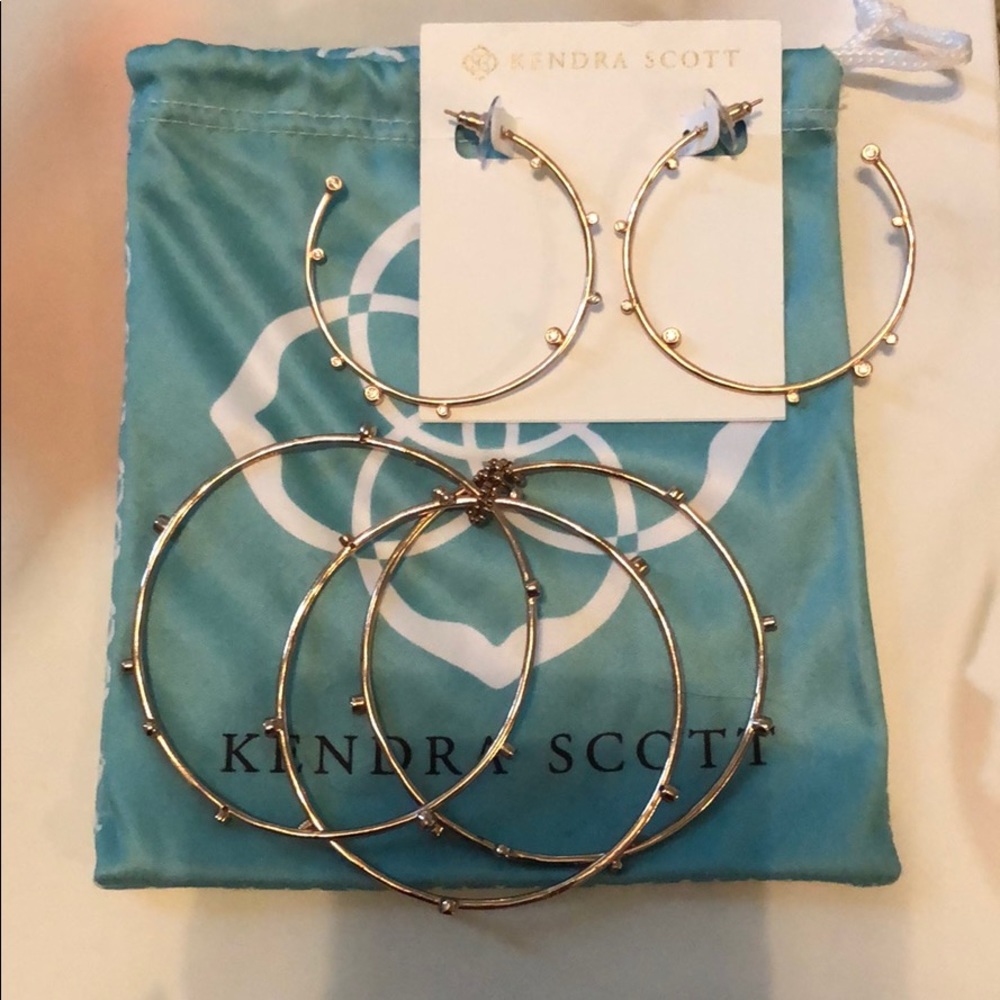 Kendra Scott rose gold earrings and bracelet set.